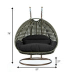 LeisureMod Sedia a Uovo Sospesa per 2 Persone con Supporto - Dondolo Pensile per Esterni/Interni in Rattan Intrecciato con Cuscini